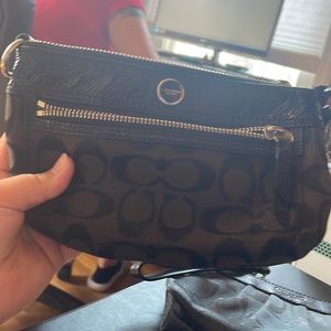 This coach hand bag is cute for going somewhere small